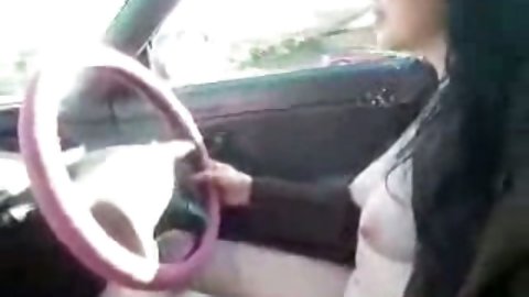 Sometimes my kinky brunette bitch gets too horny and rides her car totally naked letting passing drivers see her saggy tits and her dirty cunt.